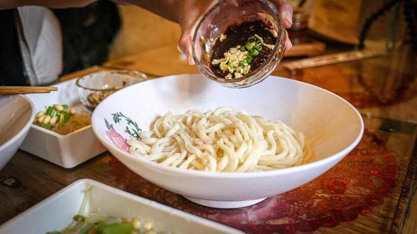 Beijing: Hidden Gems Guided Food Tour with Beer and Tastings - Beijing noodles in a hole-in-the-wall courtyard